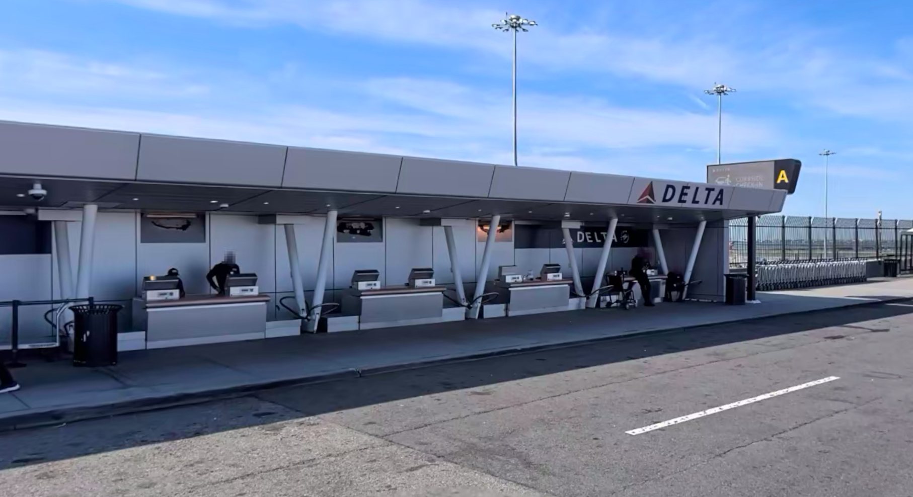 Curbside check-in counters outside an airport terminal