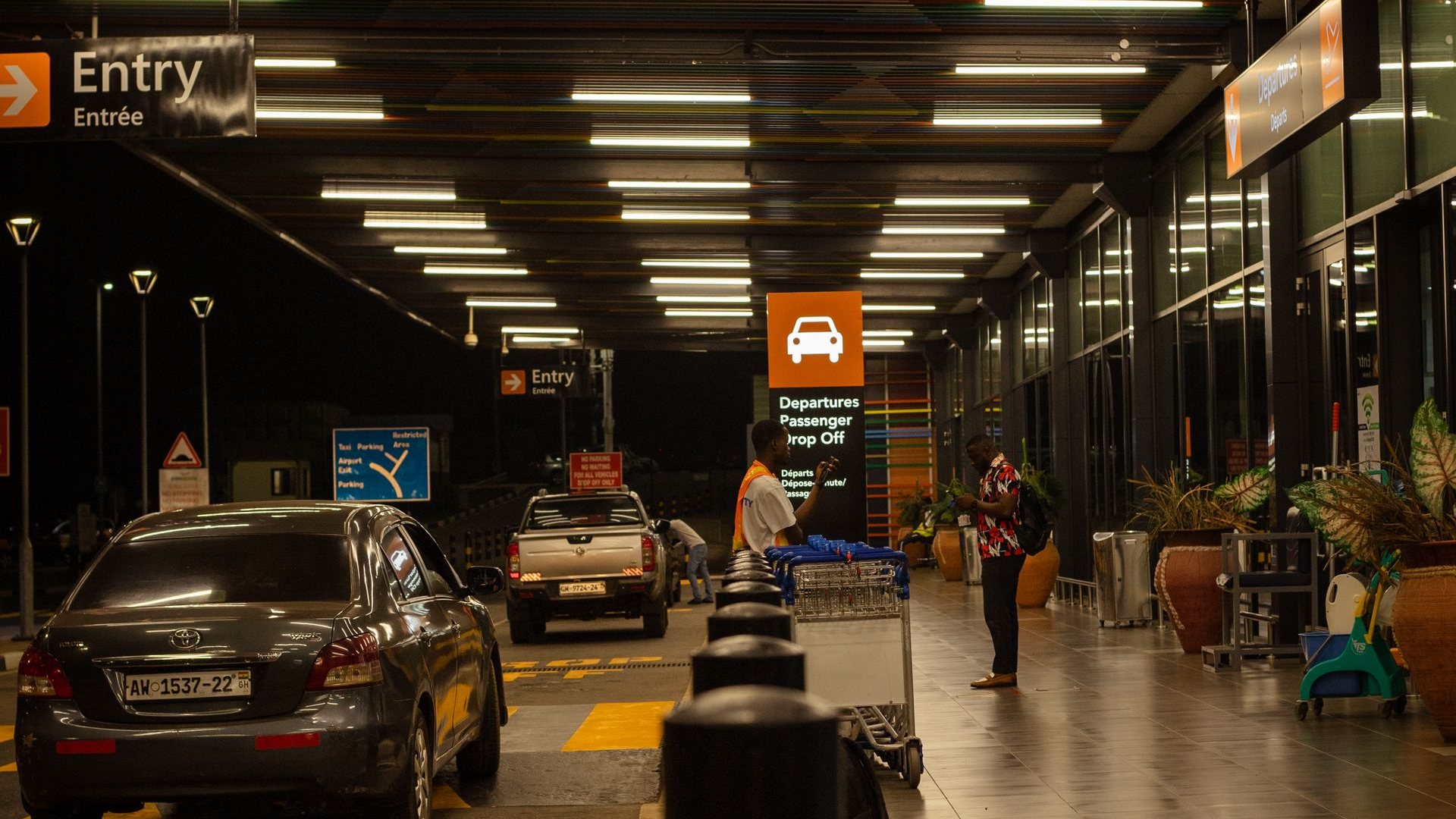 Airport passenger drop-off zone at night